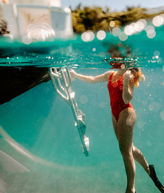 two people snorkeling off charter boat